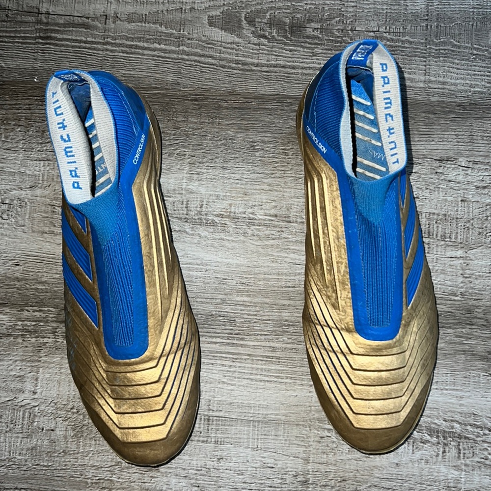 Adidas blue and gold mens cleats size 9.5 Mens USA